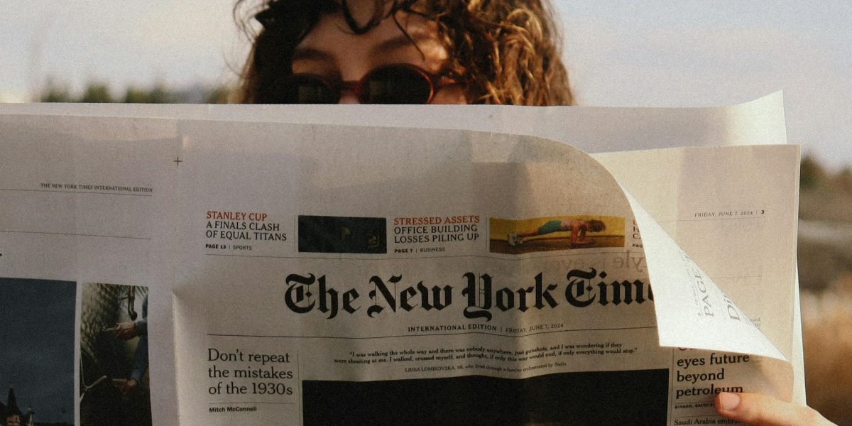 A person engaging in lateral reading, carefully cross-referencing information from multiple sources.