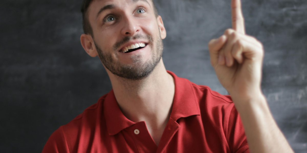 A person experiencing a sudden realization or creative breakthrough, symbolizing cognitive abilities beyond raw IQ.