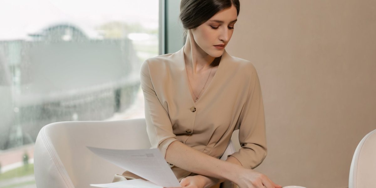A person diligently reviewing course materials or a case study, reflecting the deep analysis required in effective online learning.