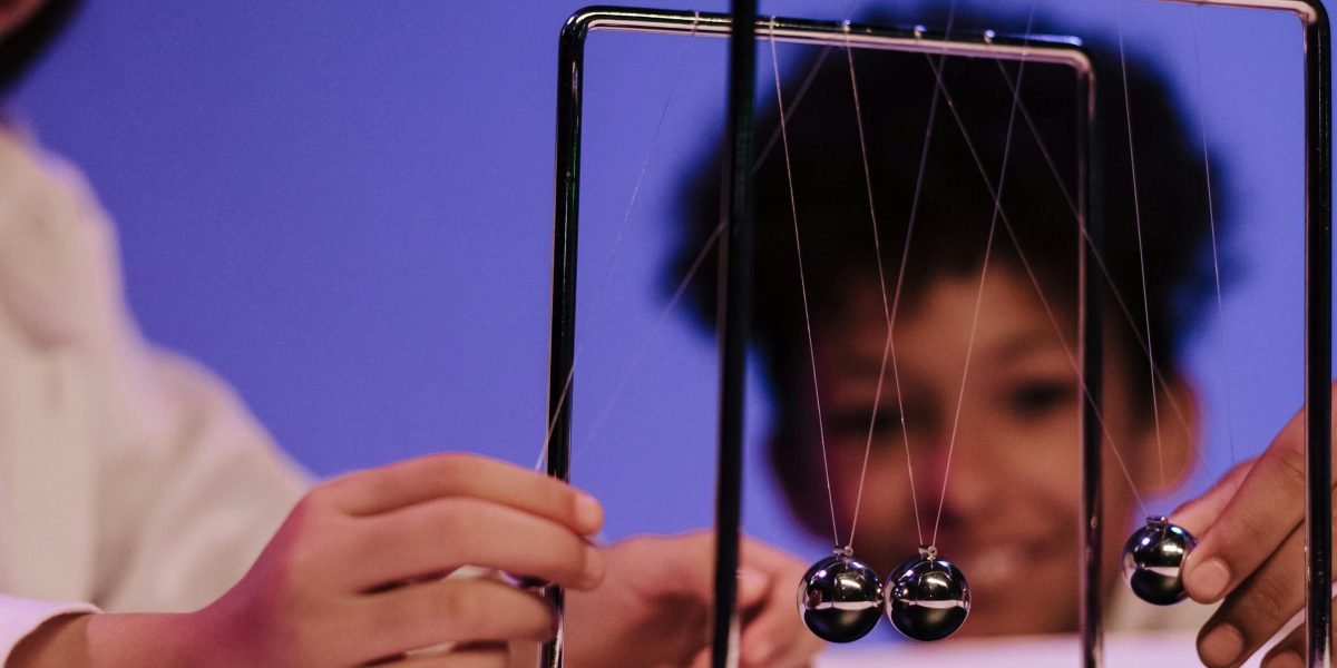 A student actively participating in a hands-on experiment or project, demonstrating inquiry-driven learning.