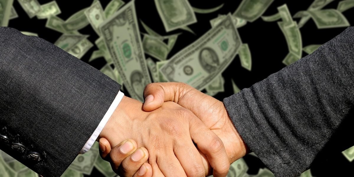 Business professionals engaging in a negotiation, aiming for favorable terms.