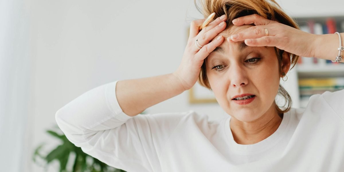 A person looking overwhelmed while trying to process a constant stream of digital information.