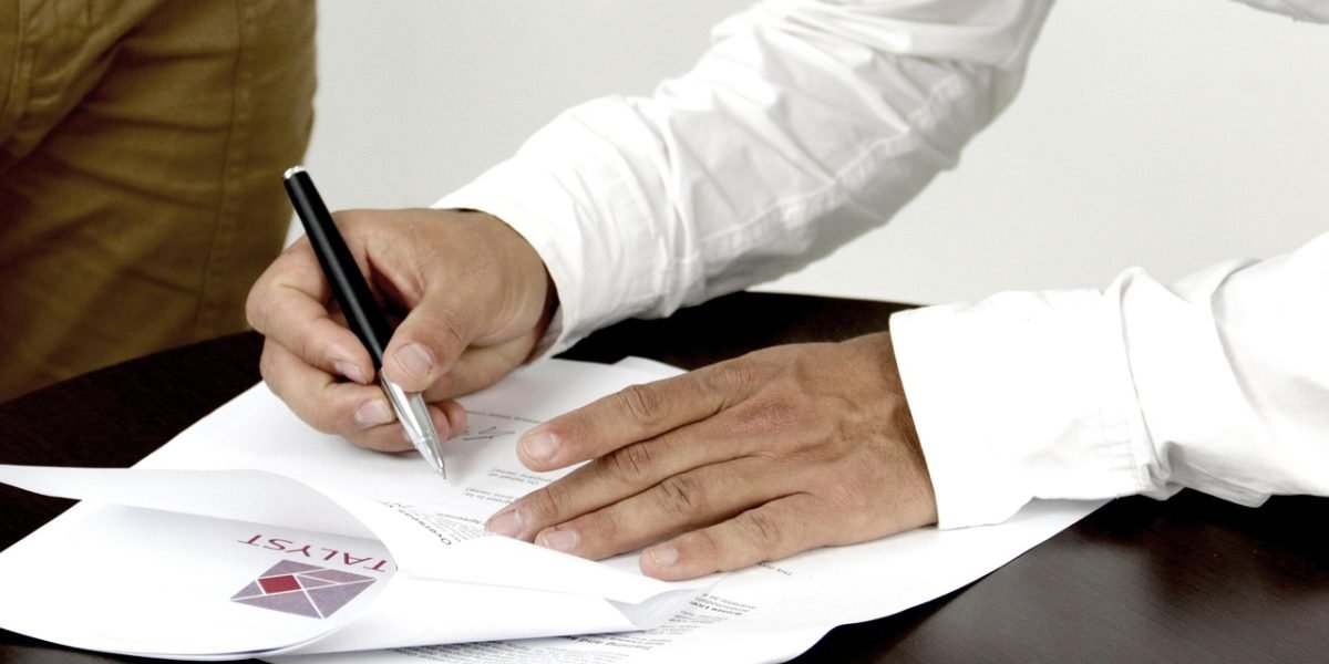 A person thoughtfully reviewing documents, symbolizing critical analysis and independent thinking in the age of AI.
