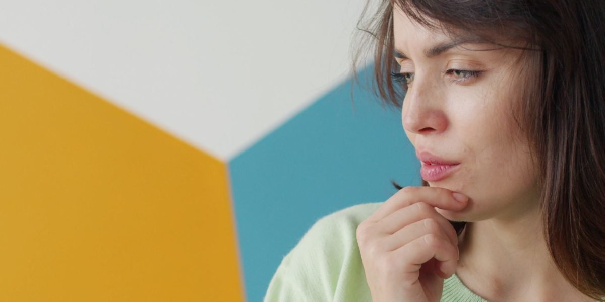 A person engaged in deep thought, reflecting critical thinking.