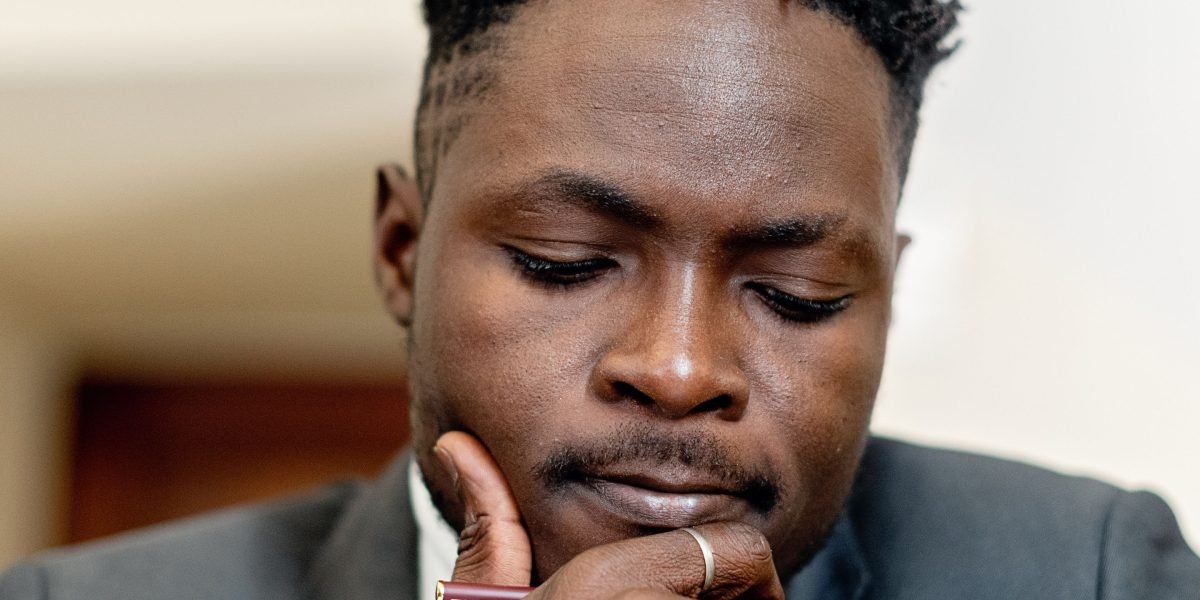 A person engaged in deep thought, reflecting the article's emphasis on critical thinking in a complex world.