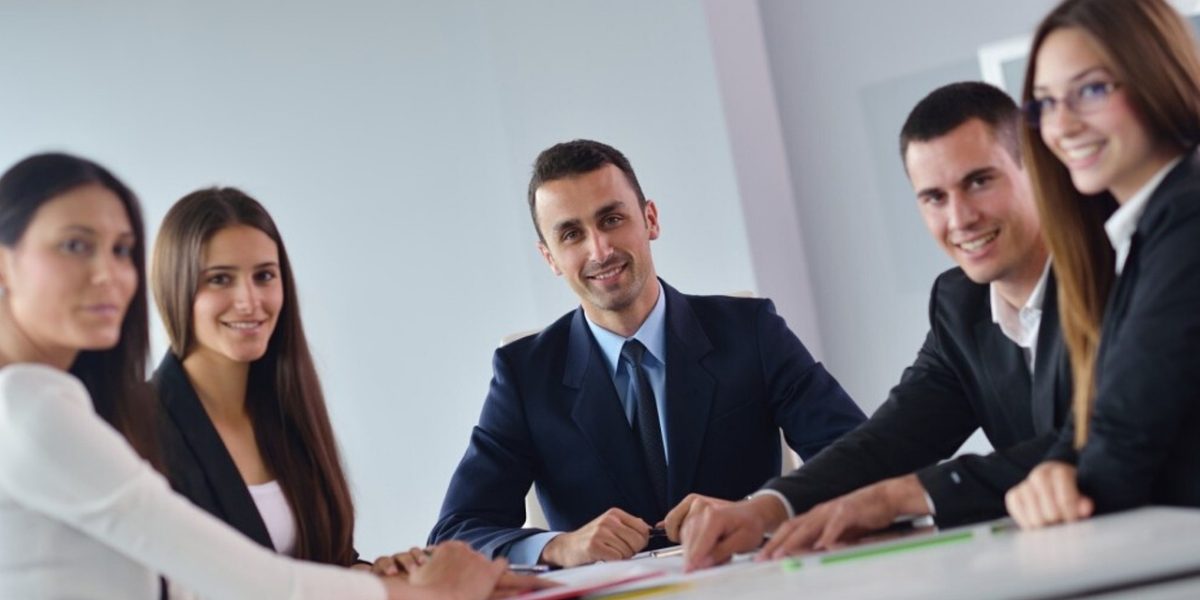 A team collaborating in a professional setting, illustrating the concept of organizational learning and enterprise solutions.