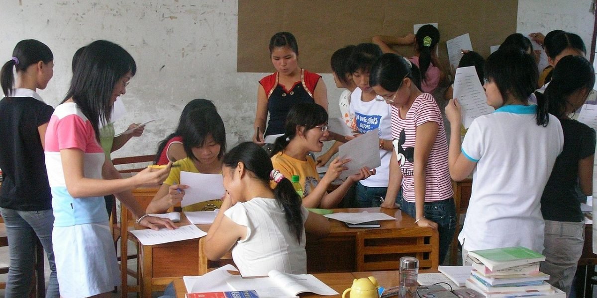 Individuals engaged in a collaborative learning environment, discussing and sharing insights, ideal for instructor-led training.