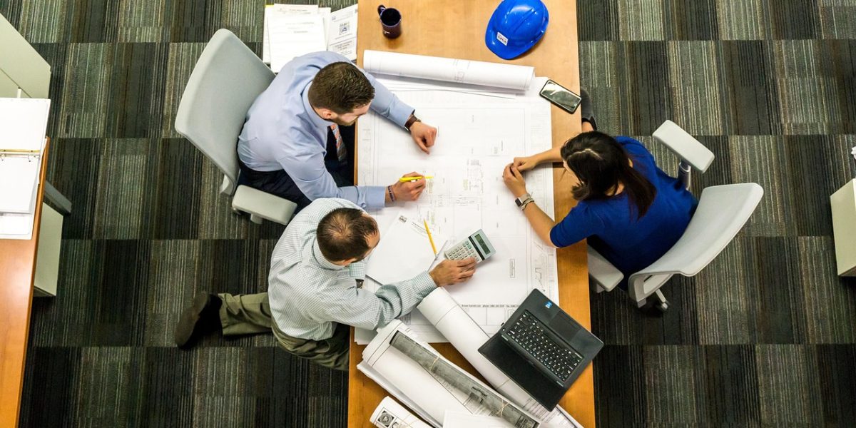 A business team in a meeting, using data insights for strategic planning and decision-making.