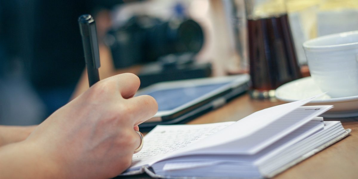 An individual diligently documenting their choices and reflections in a journal, fostering self-improvement.