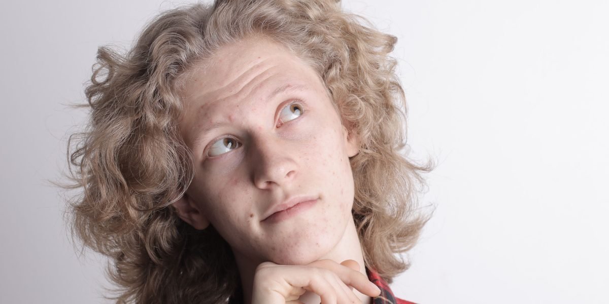 A person deep in thought, perhaps questioning initial assumptions or seeking deeper insights to avoid cognitive biases.