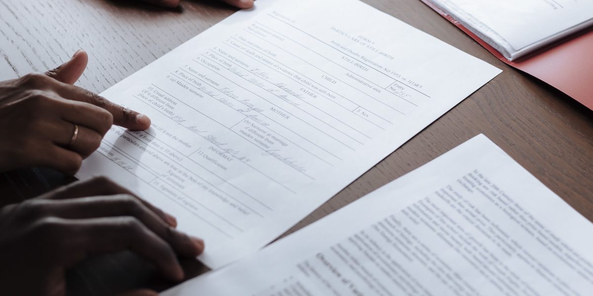 A professional diligently verifying information or checking credentials, symbolizing the importance of due diligence in choosing a BLS provider.