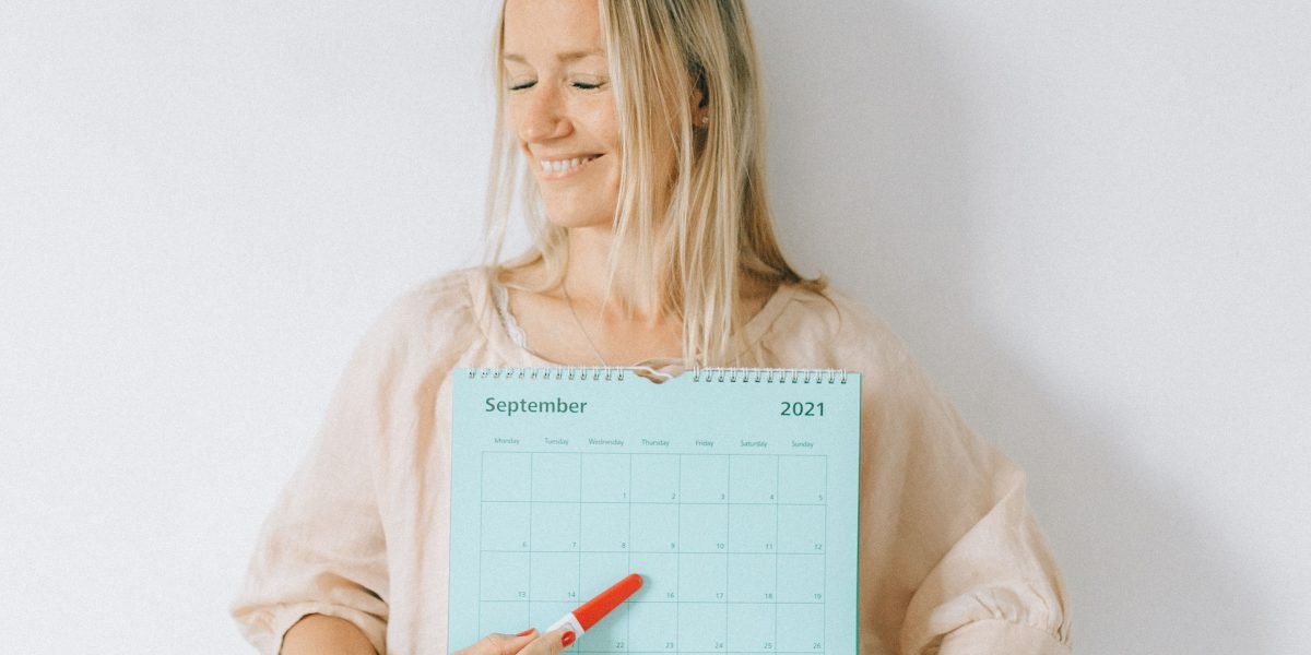 An adult learner thoughtfully organizing their schedule and future educational goals.