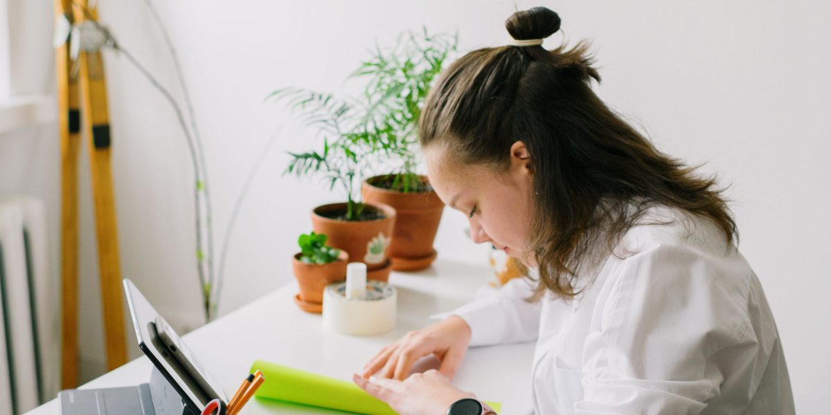 An individual focused on an online course, representing the accessible and self-paced nature of many certifications.