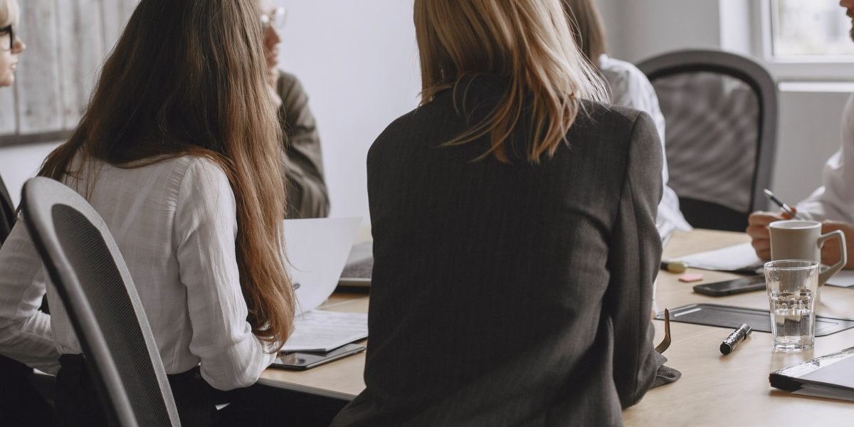 Professionals engaging in a serious discussion to make an ethical decision, guided by a structured framework.