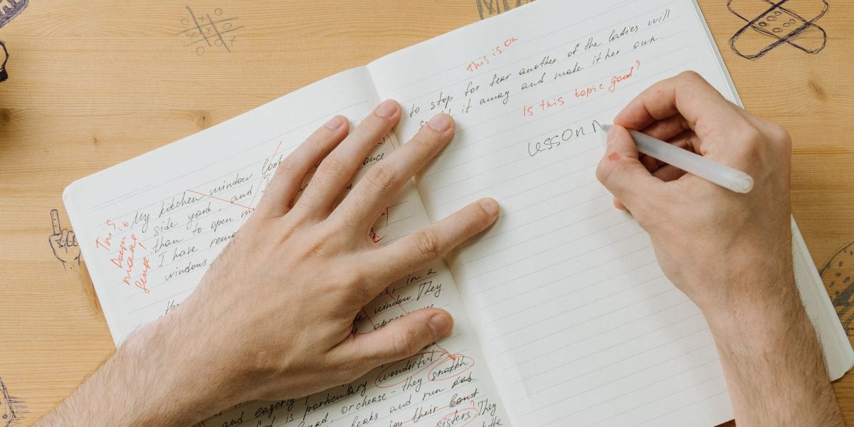 A person focused on a whiteboard, writing notes and brainstorming, symbolizing active analytical practice and structured thinking.