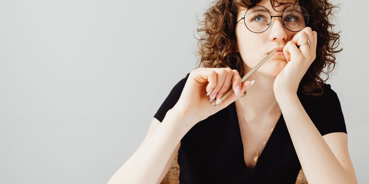 An individual carefully considering options, symbolizing the importance of choosing the right course.
