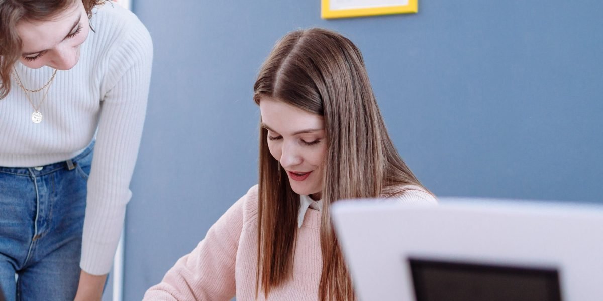 A coach or mentor providing guidance and support to a student during a learning session.