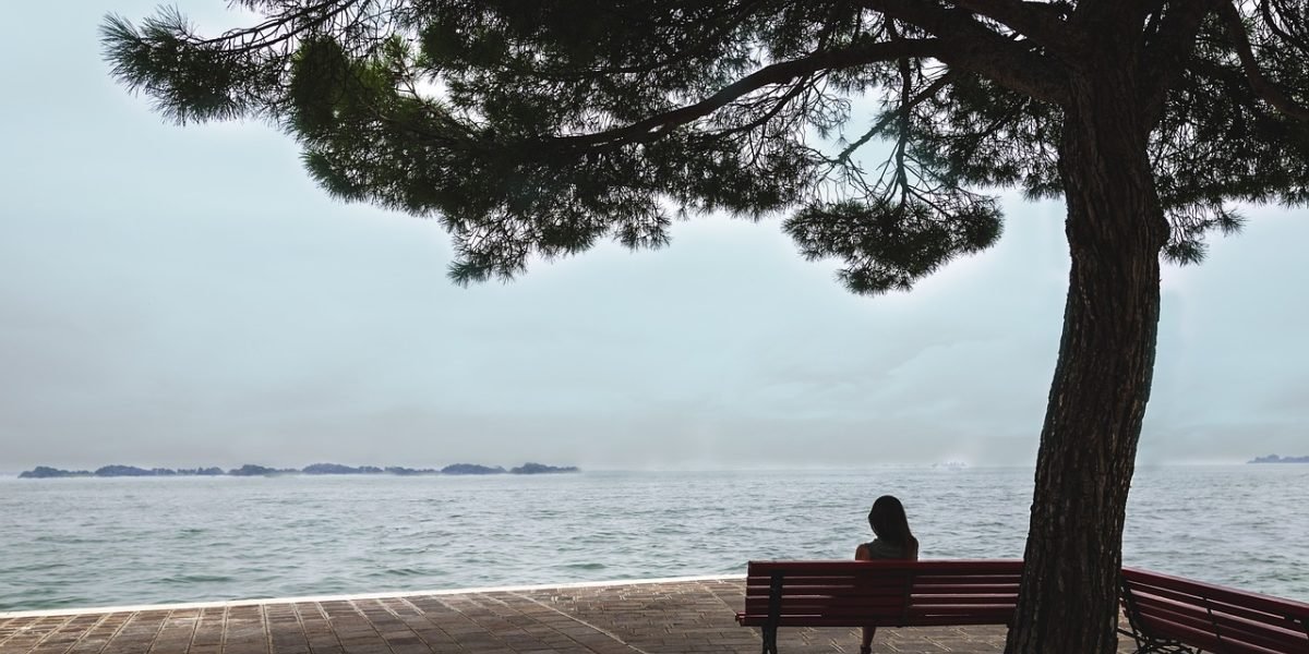 A person deep in thought, perhaps pondering the exact meaning of a concept or searching for the right words.
