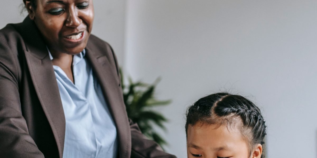 An advisor or tutor providing one-on-one guidance to a student in an academic setting.